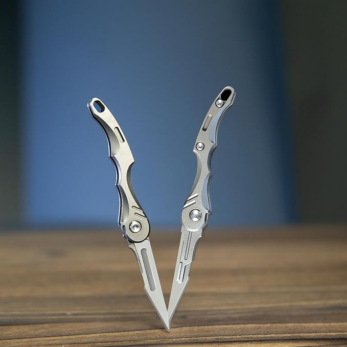 Mini Titanium Practical Pocket Folding Knife for Daily Use Equipped with 5 No. 11 quick change blades only 13.3g and a large keyhole at the bottom for easy carrying