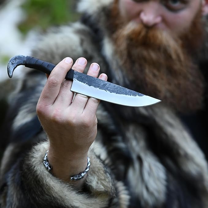 Odin's Raven Norse Viking-styled Knife 10.3 - Hand Forged 6.5 Carbon Steel Blade Raven's Head Hilt and Leather Sheath - Unique Medieval Seax Style - Norse Knife for Hunting &amp Camping