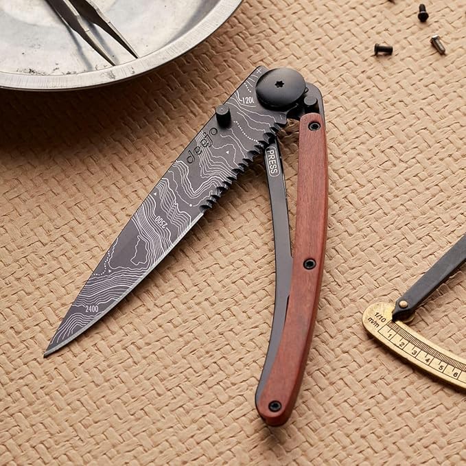 deejo - 37G Serrated Folding Pocket Knife with Belt Clip - Topography Design 3.7-Inch Stainless Steel Blade Black Titanium Finish Coral Handle - Lightweight EDC for Home Work and Outdoor Use